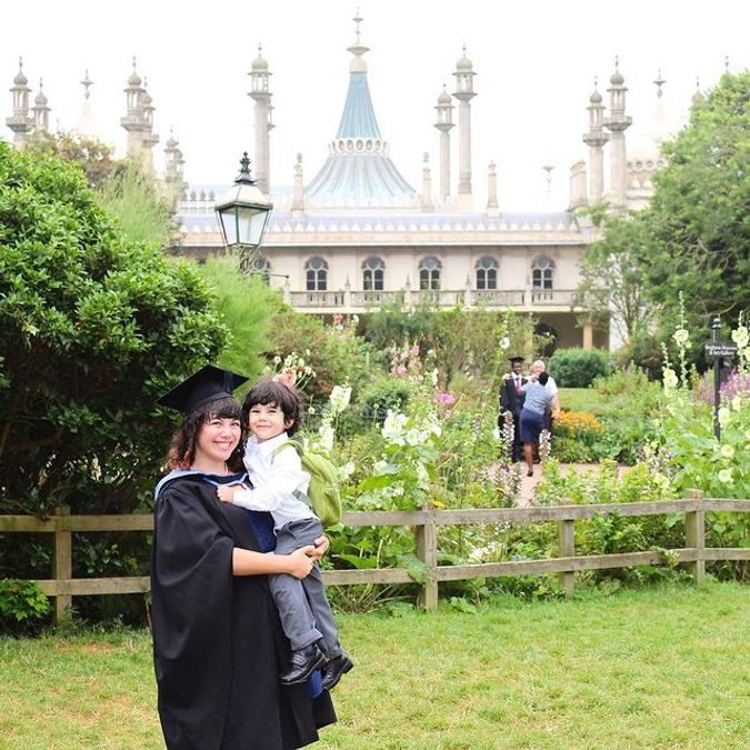 Graduation photo in the gardens of the Brighton Pavilion.