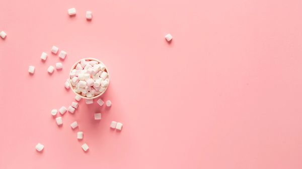 Marshmallows on a pink background.