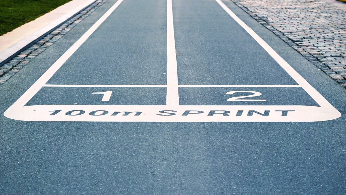 Two lanes on a blue, 100 metre running track.