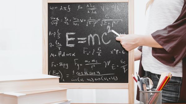 Blackboard containing lots of equations.