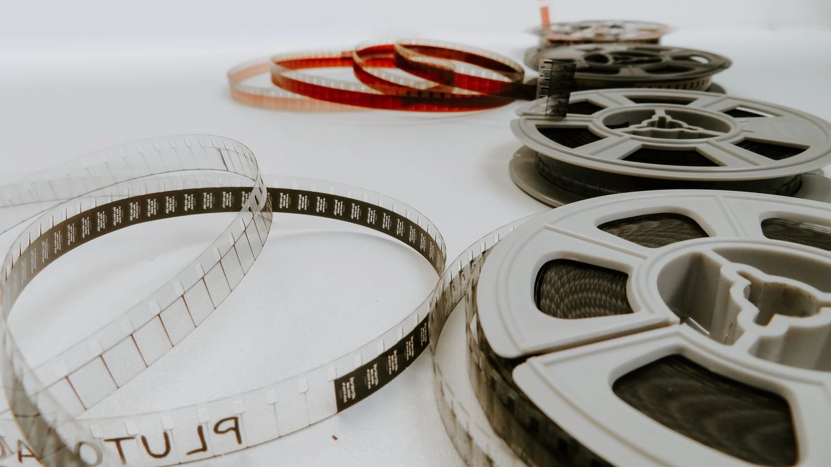 Film reels on a white background.