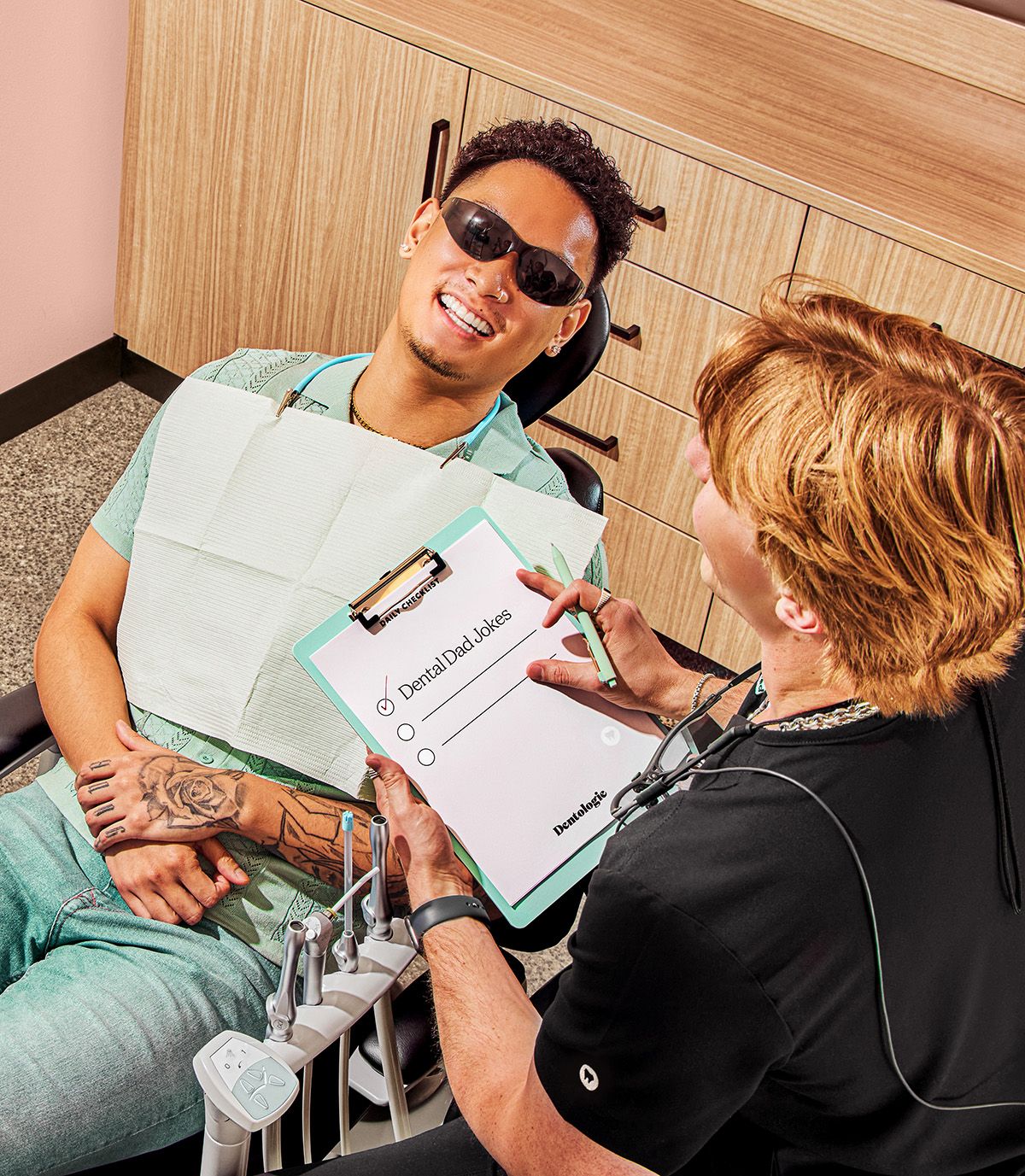 Photo of Dr. Hany Kurdi in black Dentologie scrubs, smiling for the camera.