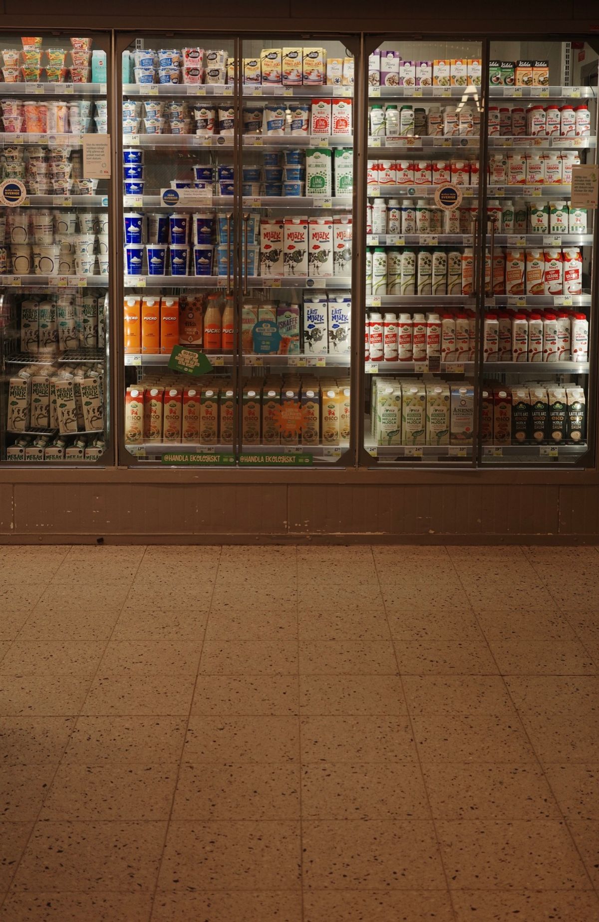 A wall of dairy products in a Stockholm grocery store