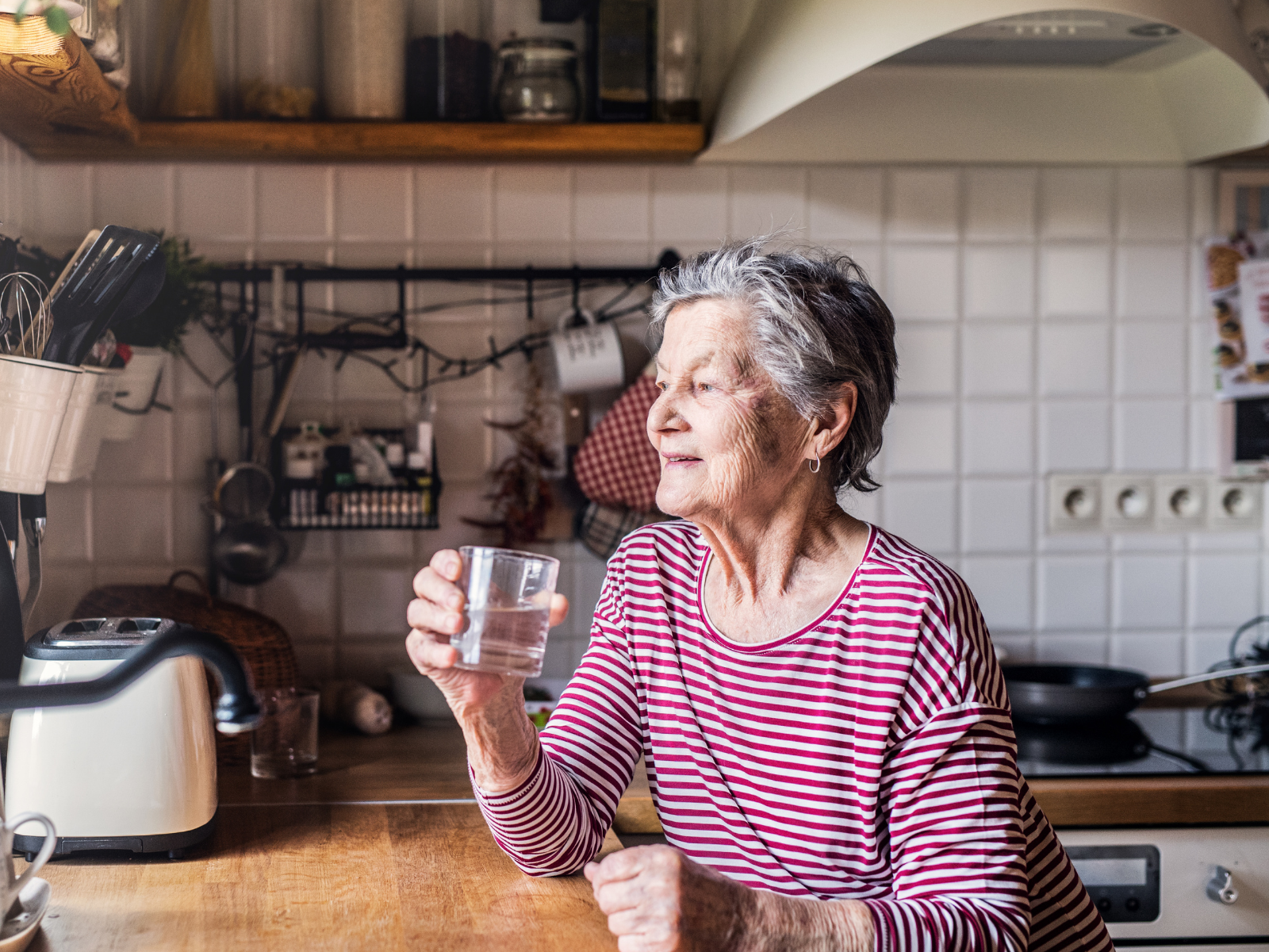 Woman in Kitchen Preparing for PACE Home Visit