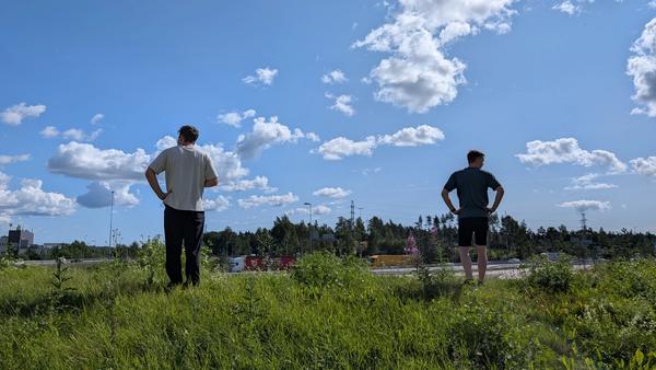 Two people contemplatively enjoying a sunny view