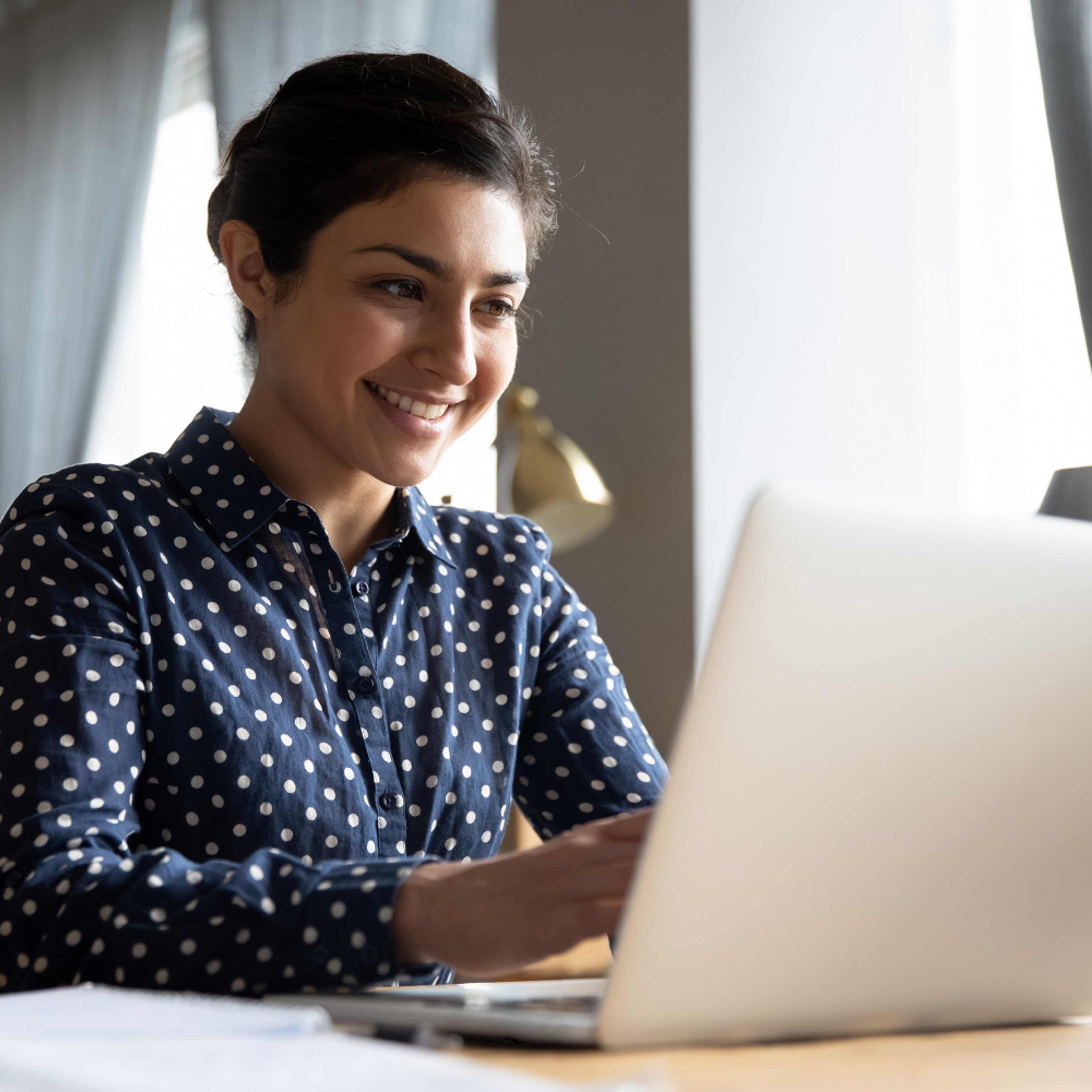 Happy lawyer behind laptop
