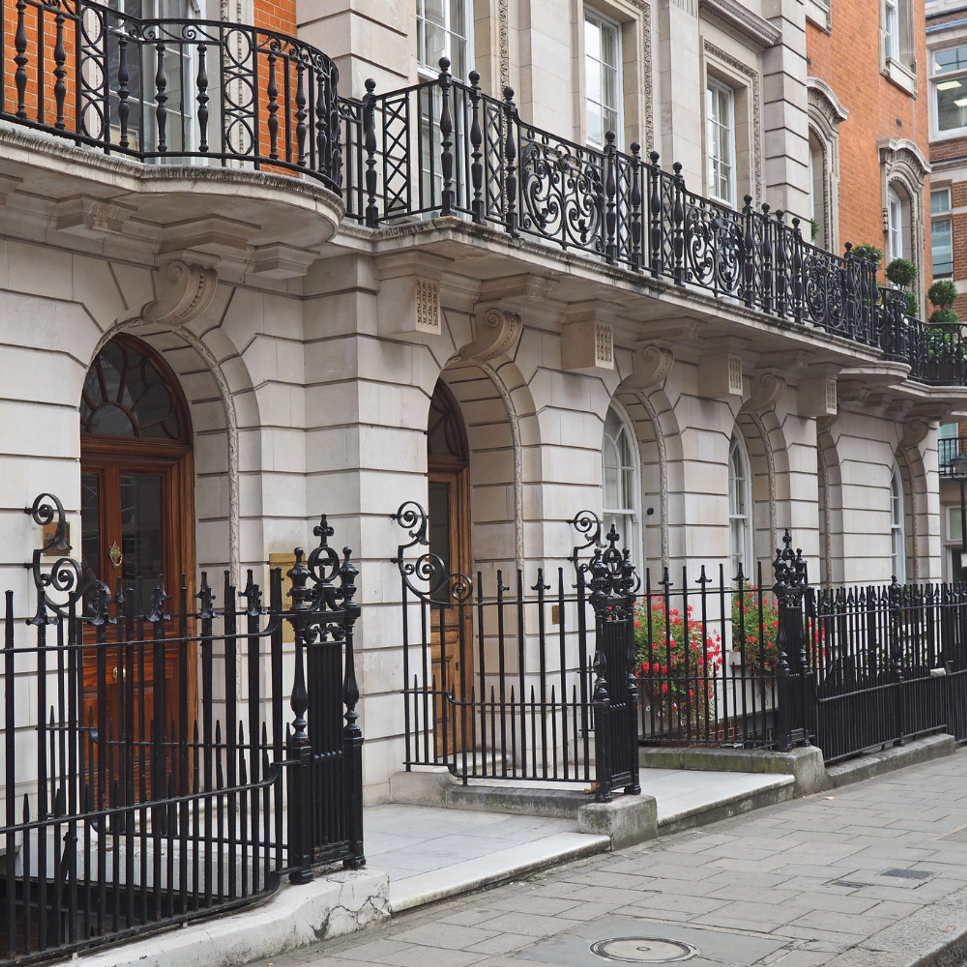 Central London law office entrances with black steel fences