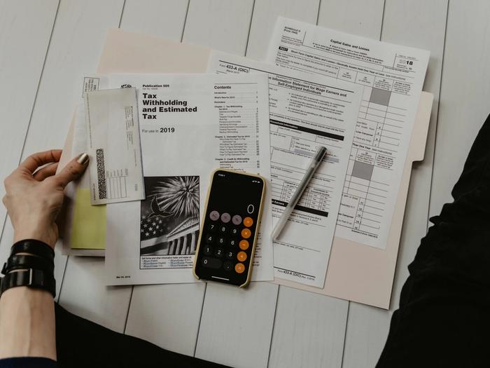 Contractor and homeowner reviewing a signed construction contract