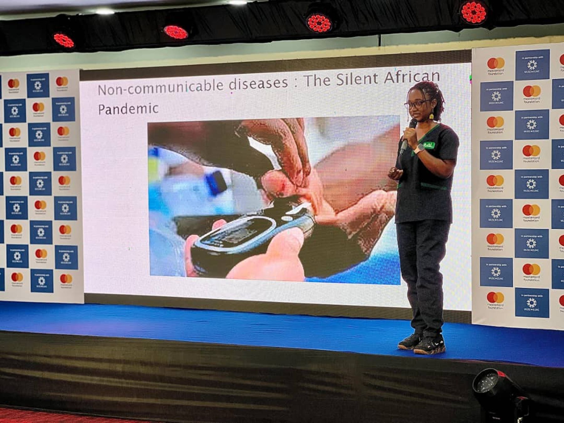 Thamar speaking at an event