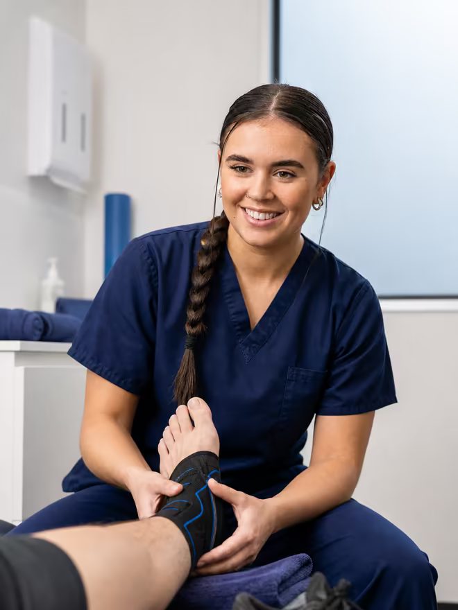 Active Step clinician assessing a sports-related ankle injury in clinic