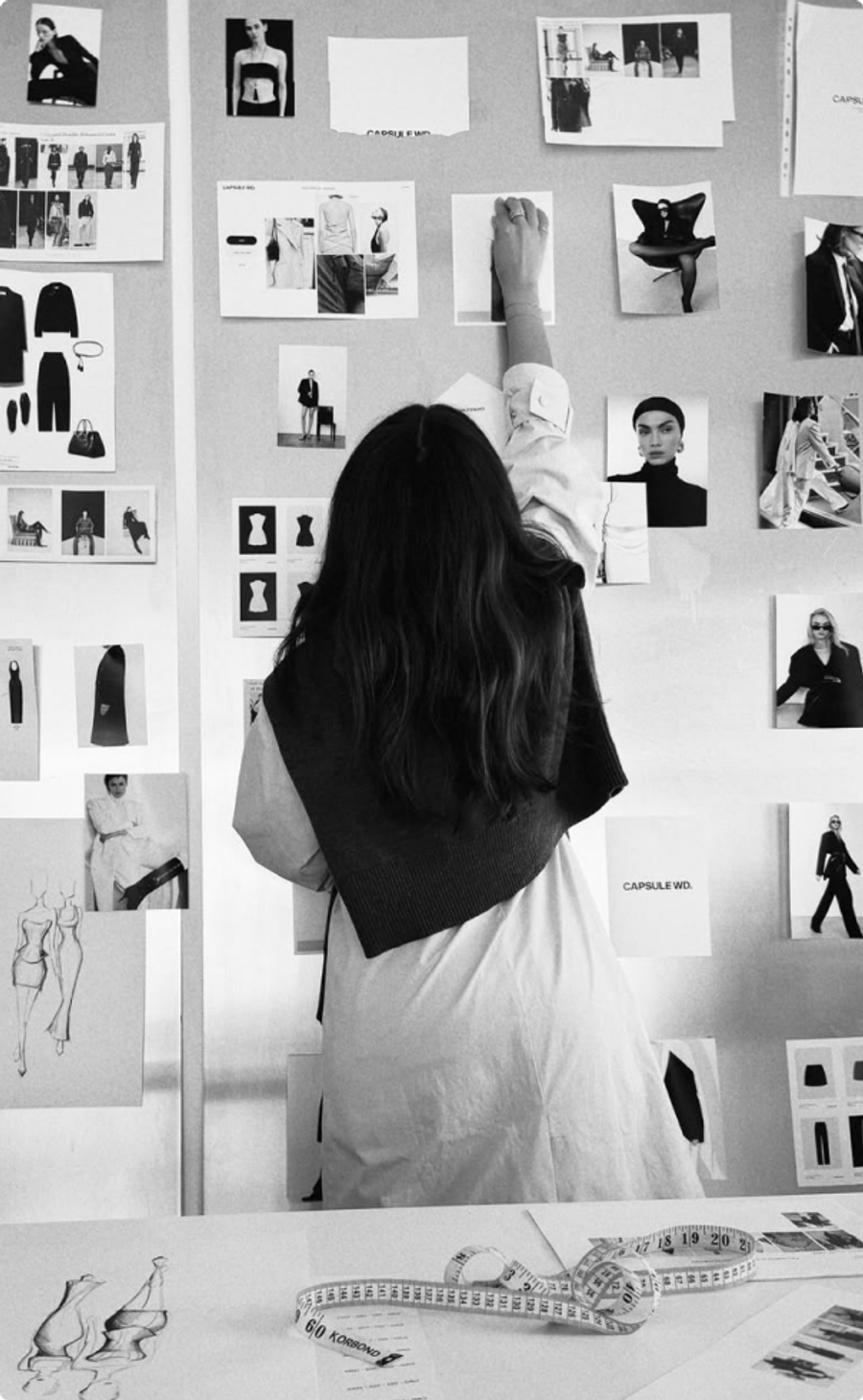 Designer pinning images to a mood board