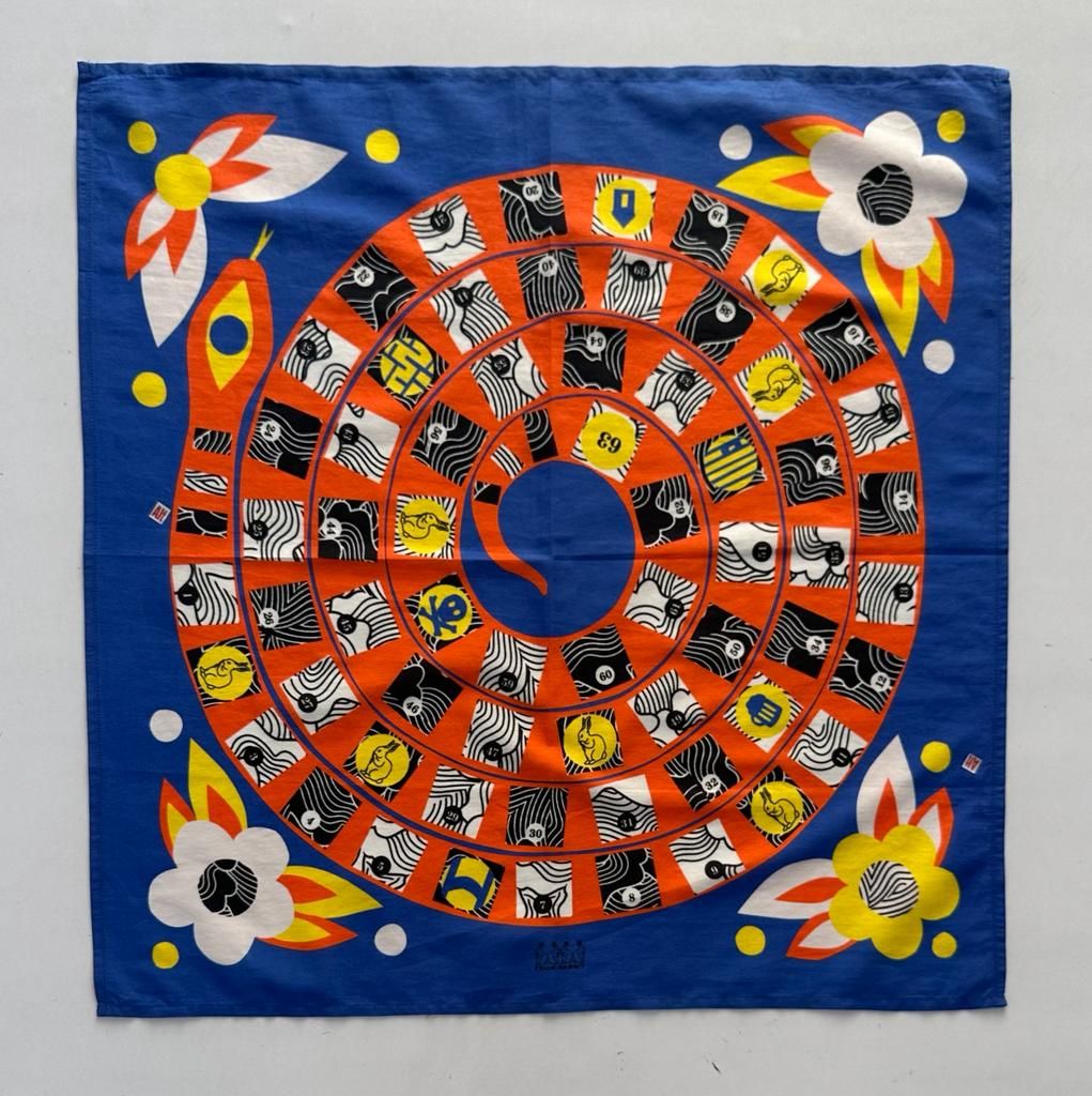 Colorful spiral board game with zebras, lions, and decorative flowers on blue background.
