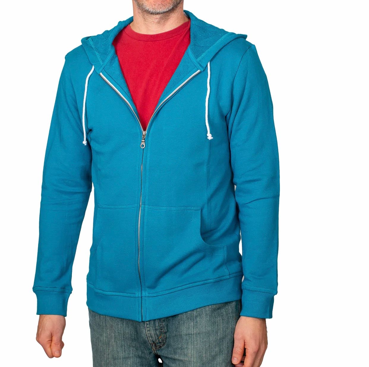 Man wearing teal zip-up hoodie over red t-shirt and jeans.