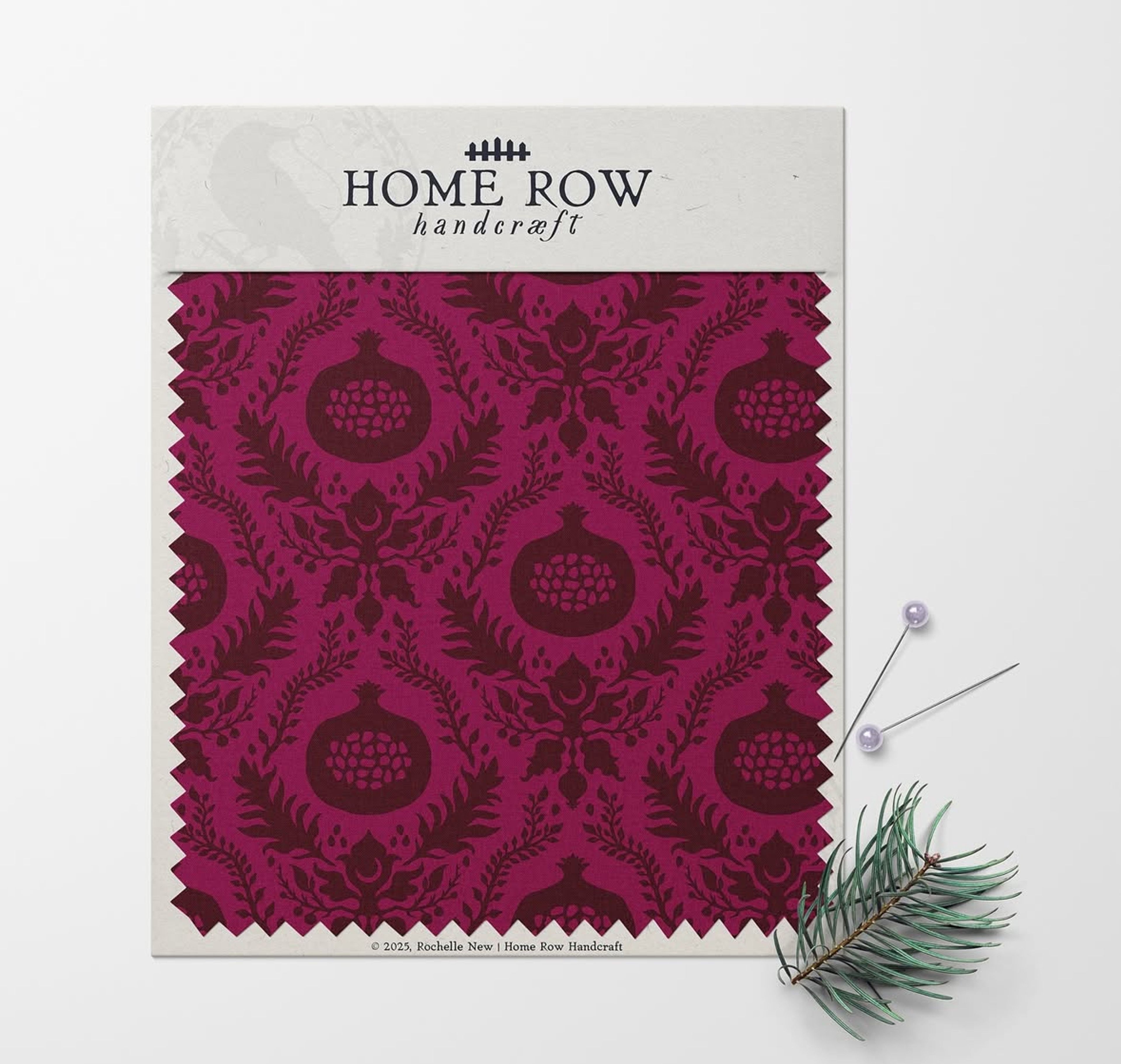 Home Row Handcraft fabric swatch in magenta with pomegranate and botanical damask pattern.