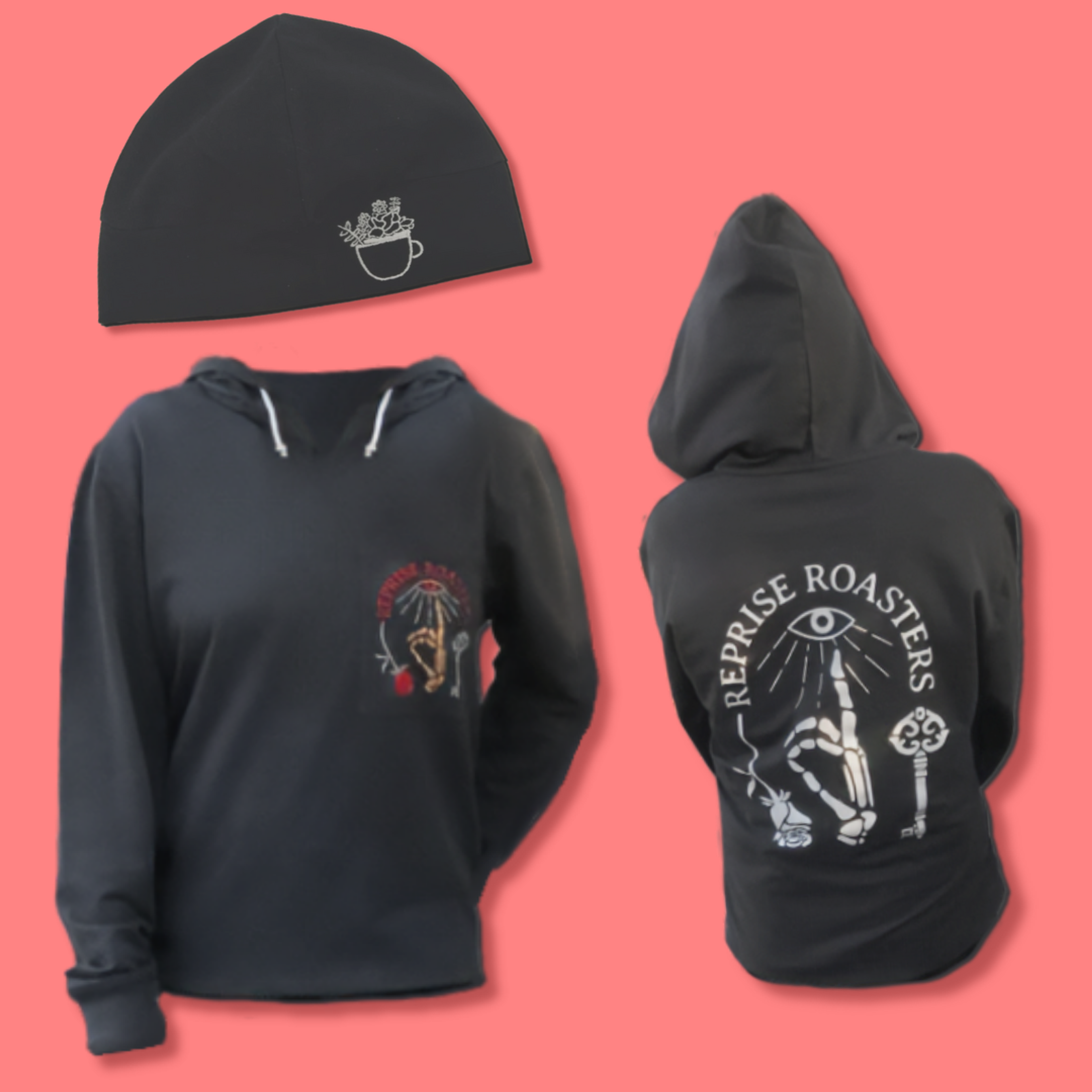 Black hoodie and beanie set with mystical graphic designs on coral background.