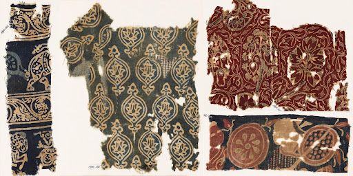 Historical textile fragments displaying ornate patterns in gold, burgundy, and blue colorways.