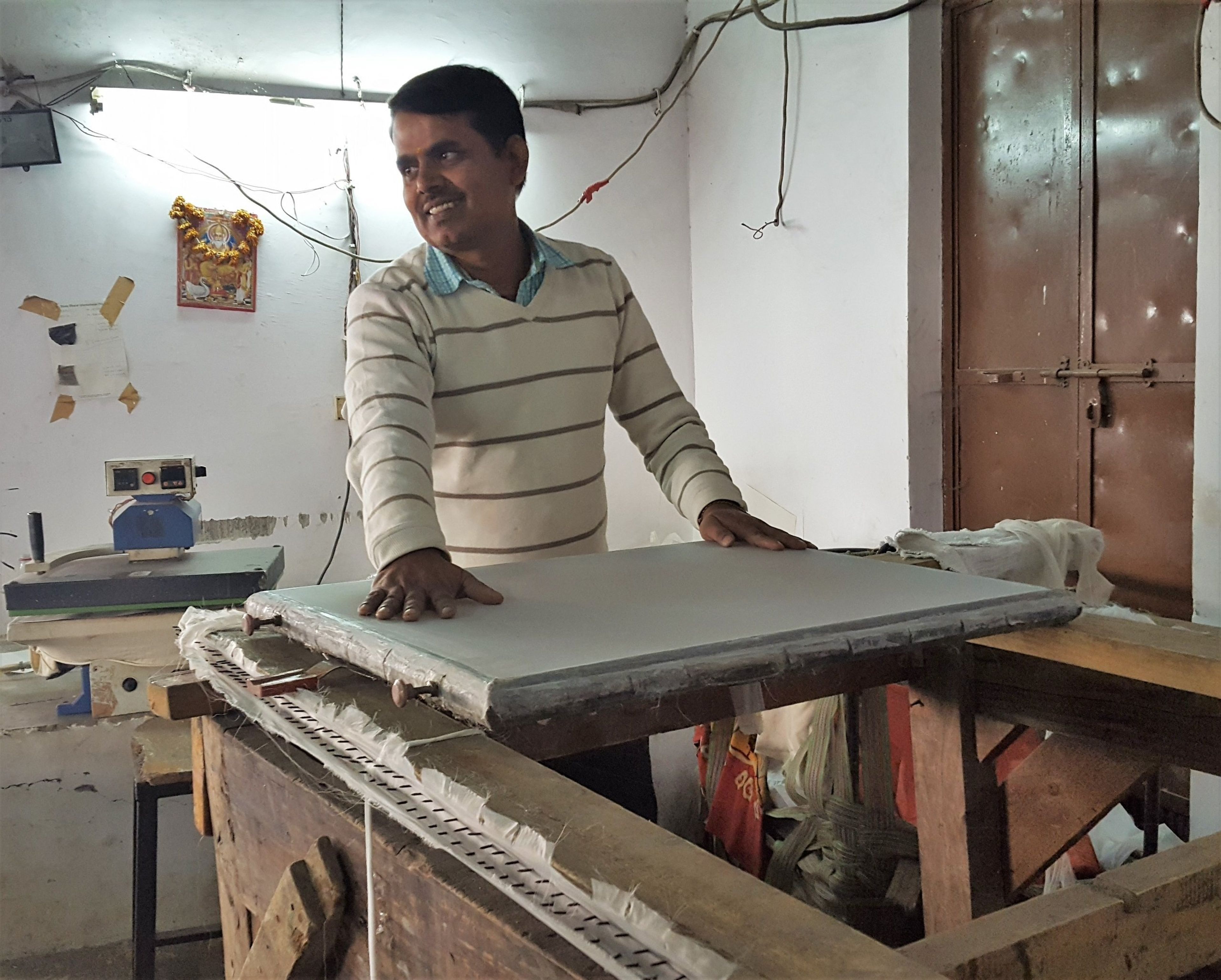 Screen printing press in operation