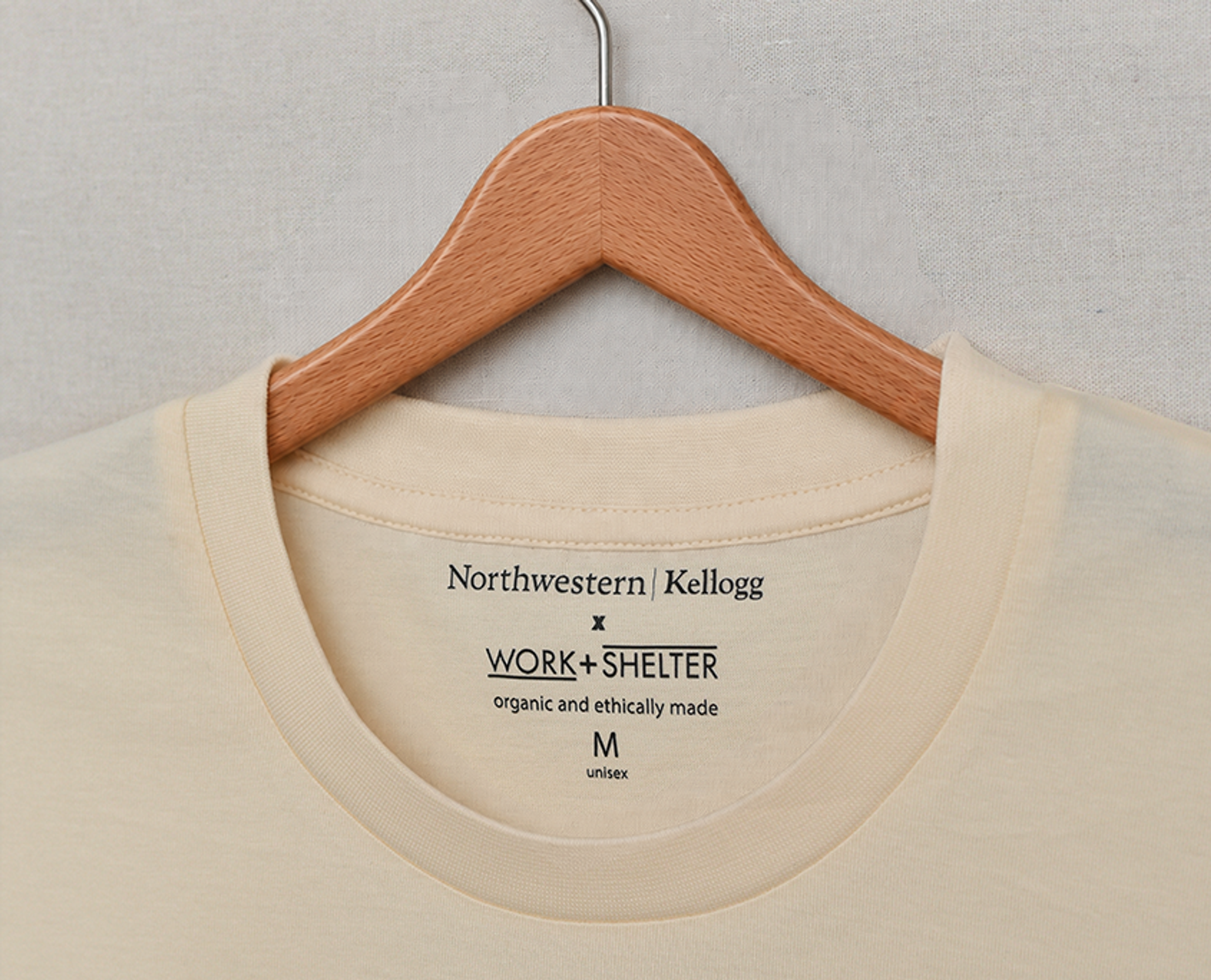 Unisex Crewneck Tee in navy with heat transfer backneck label