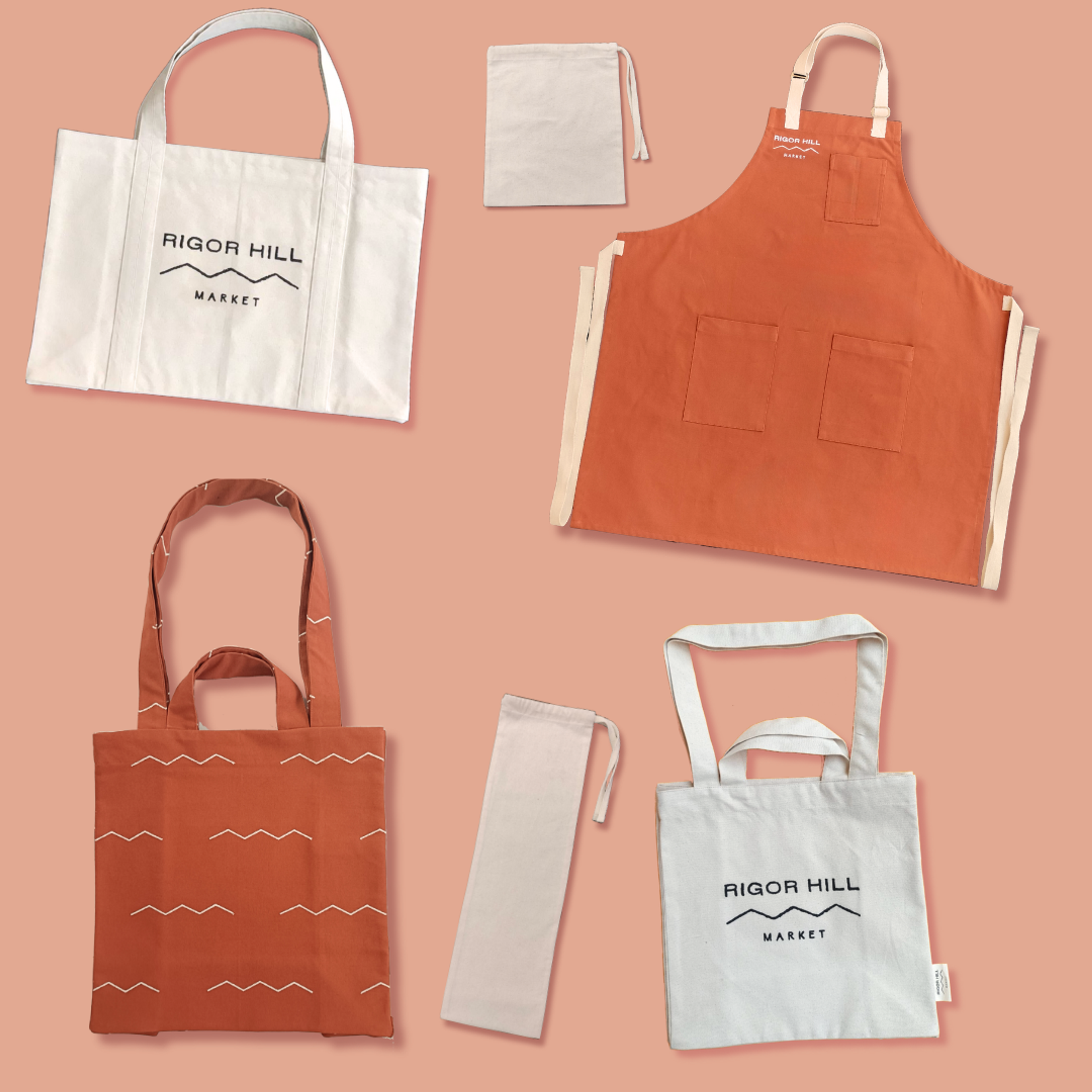Rigor Hill Market branded merchandise set: tote bags, apron, and drawstring pouches in cream and rust colors.