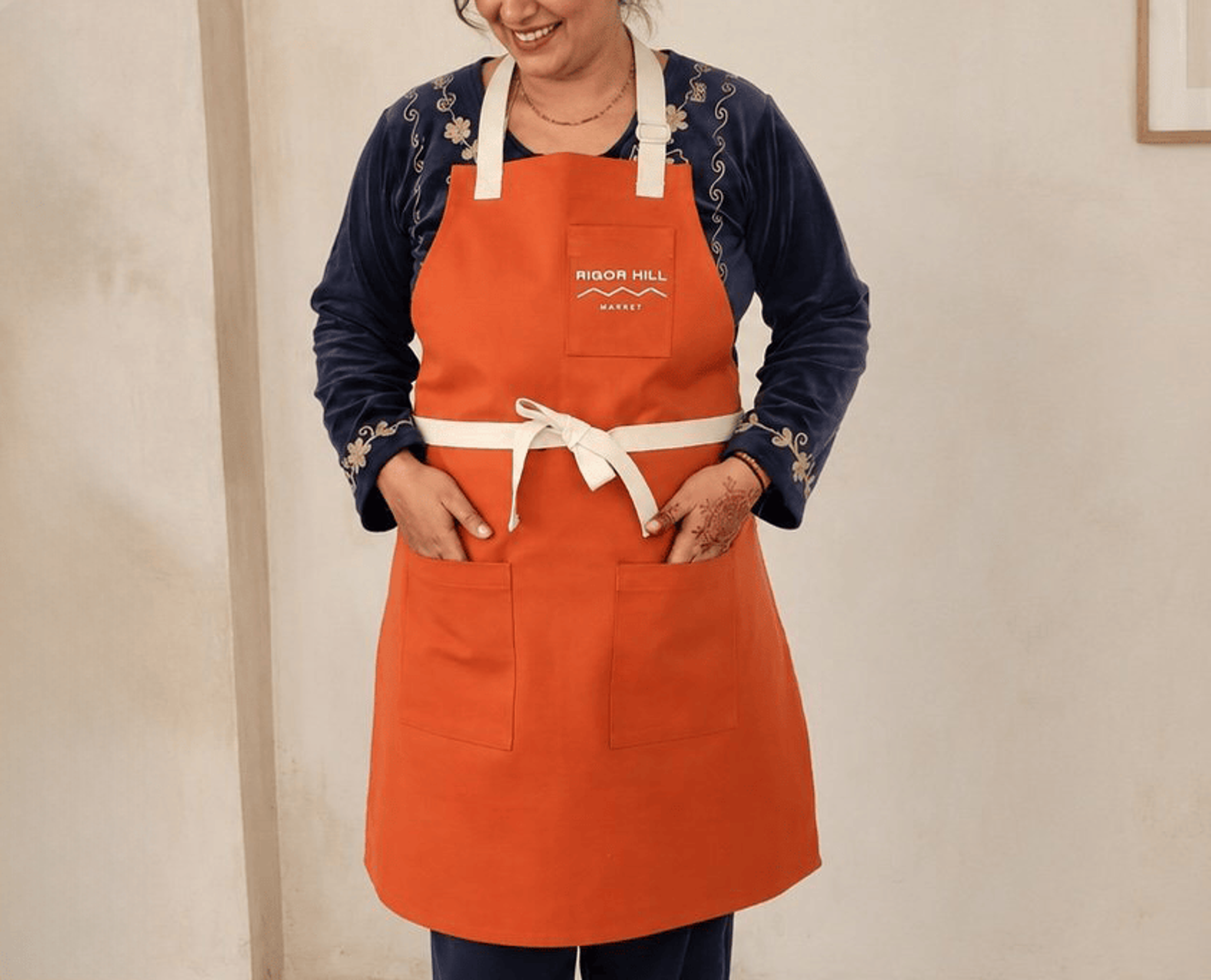 Three Pocket Apron with embroiderd logo on pocket.