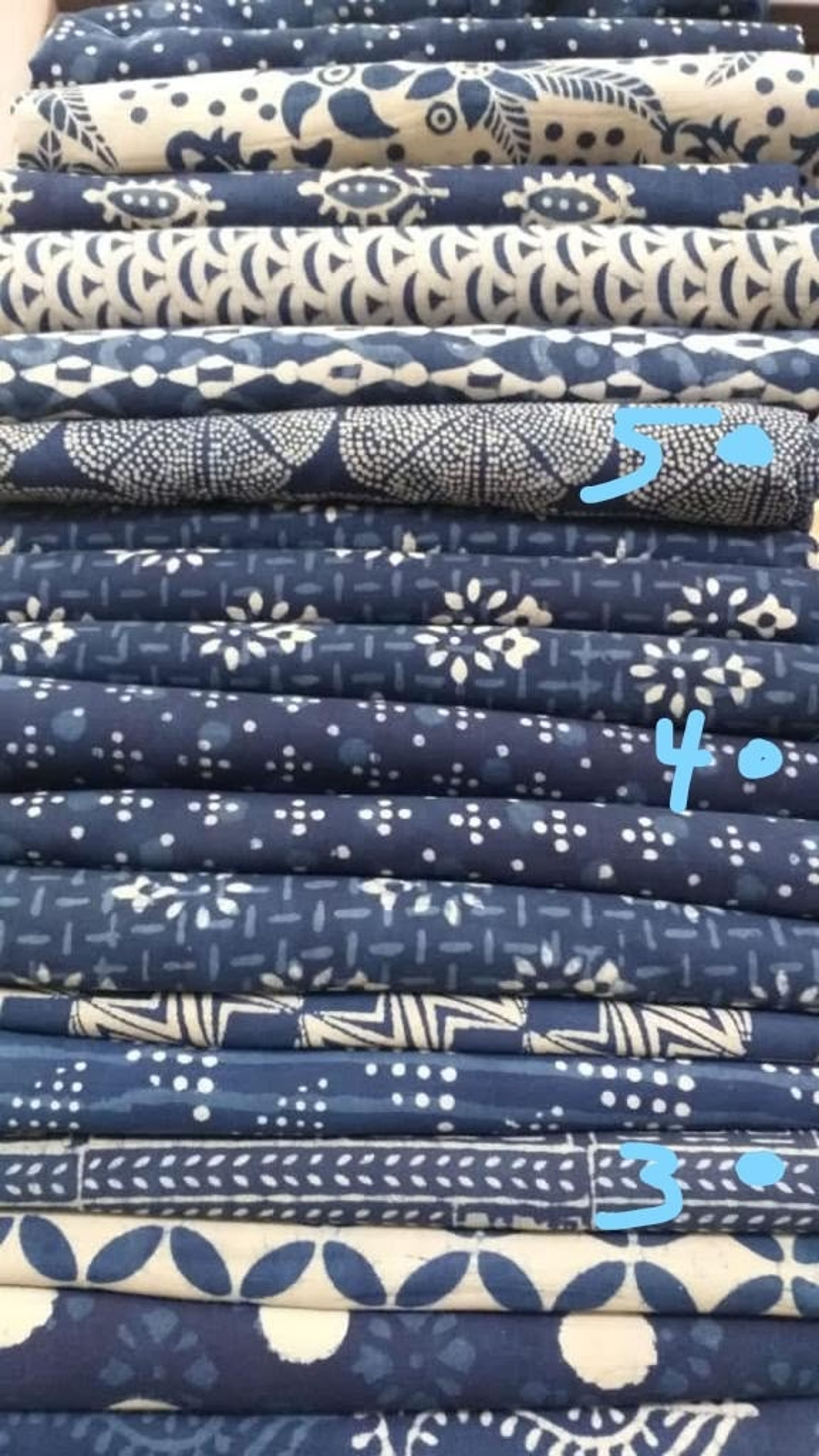 Hand block printing pattern on fabric