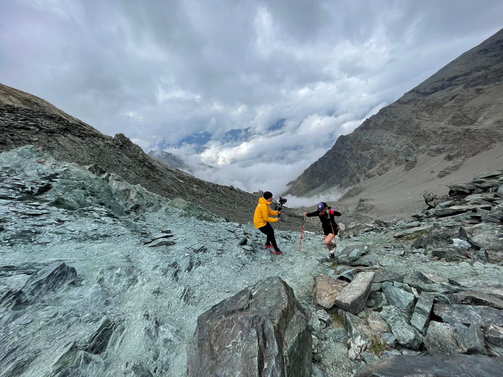 Photographer on location on a mountainside.
