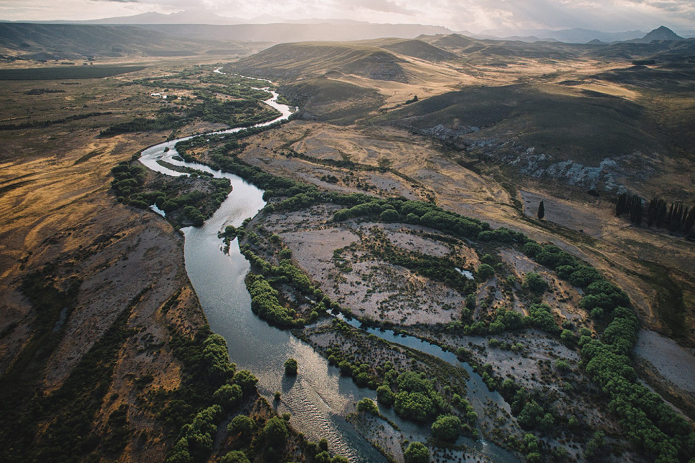 Arial view of a river winding through a valley.