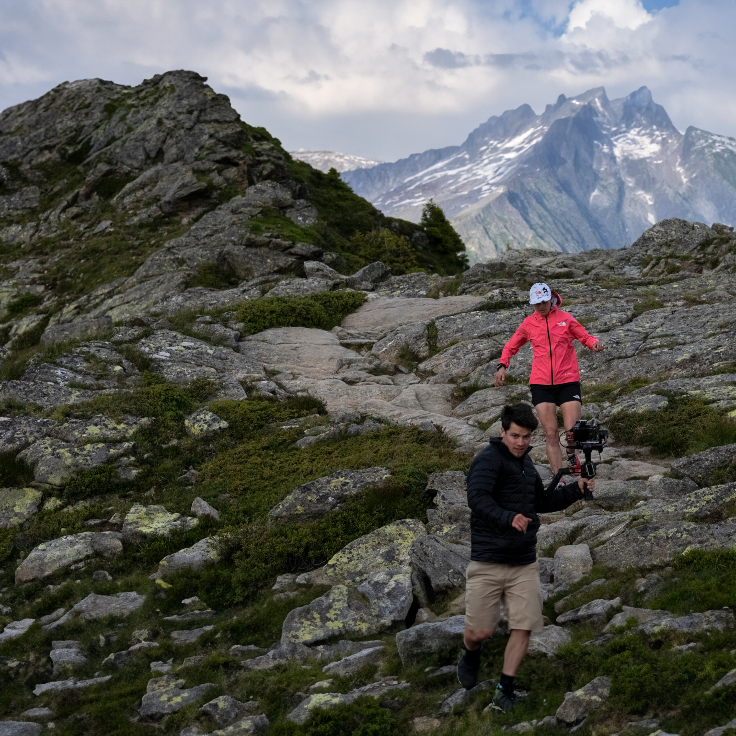 Man filming woman hiking