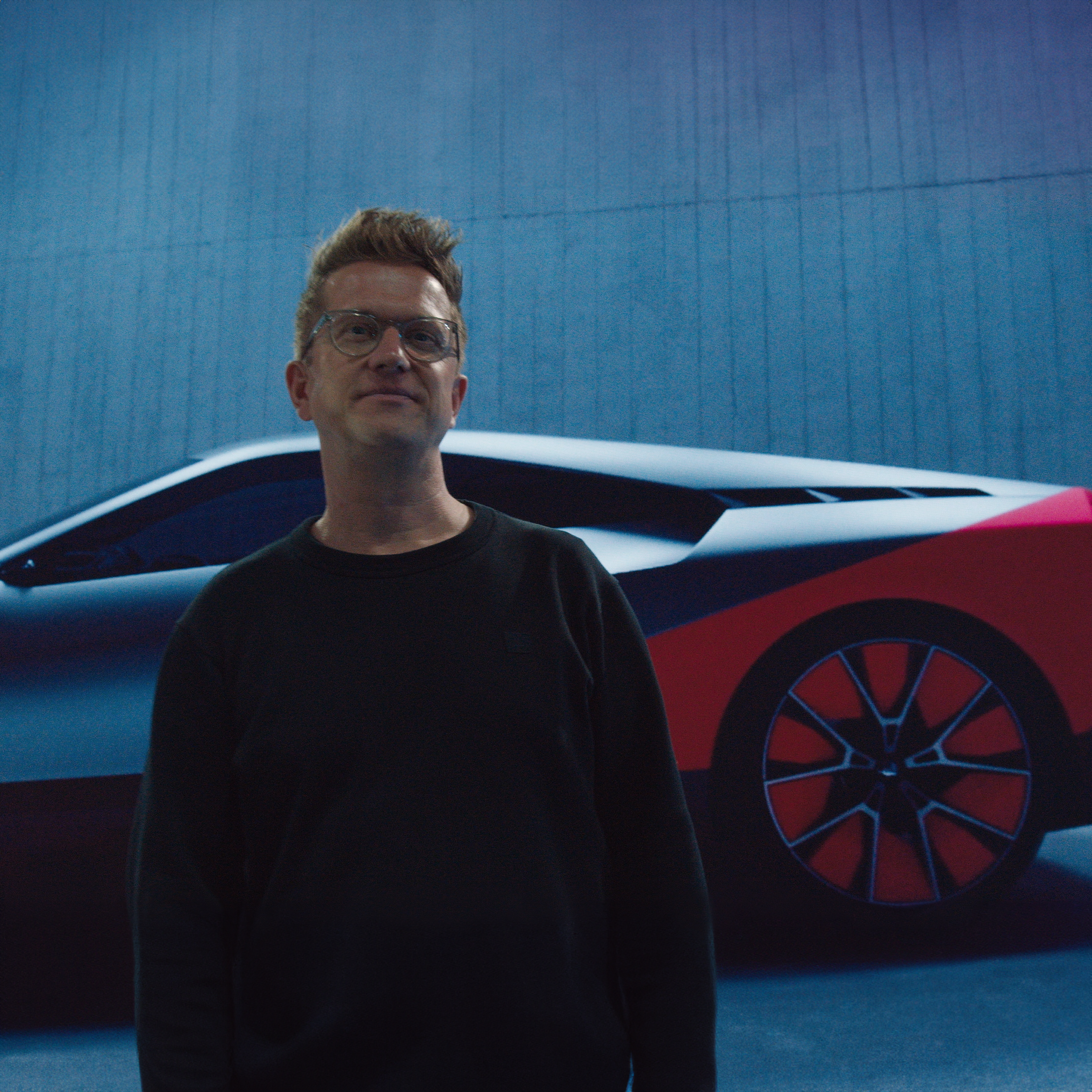 Man standing in front of car