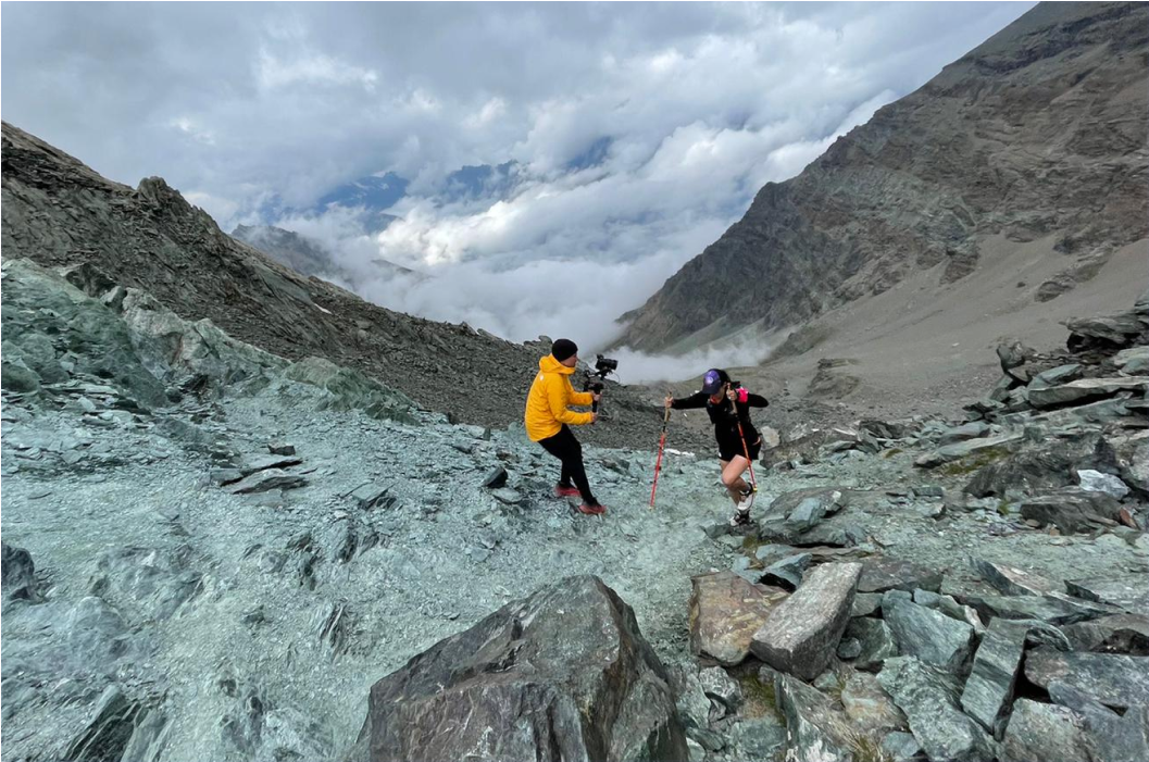 Photographer on location on a mountainside.