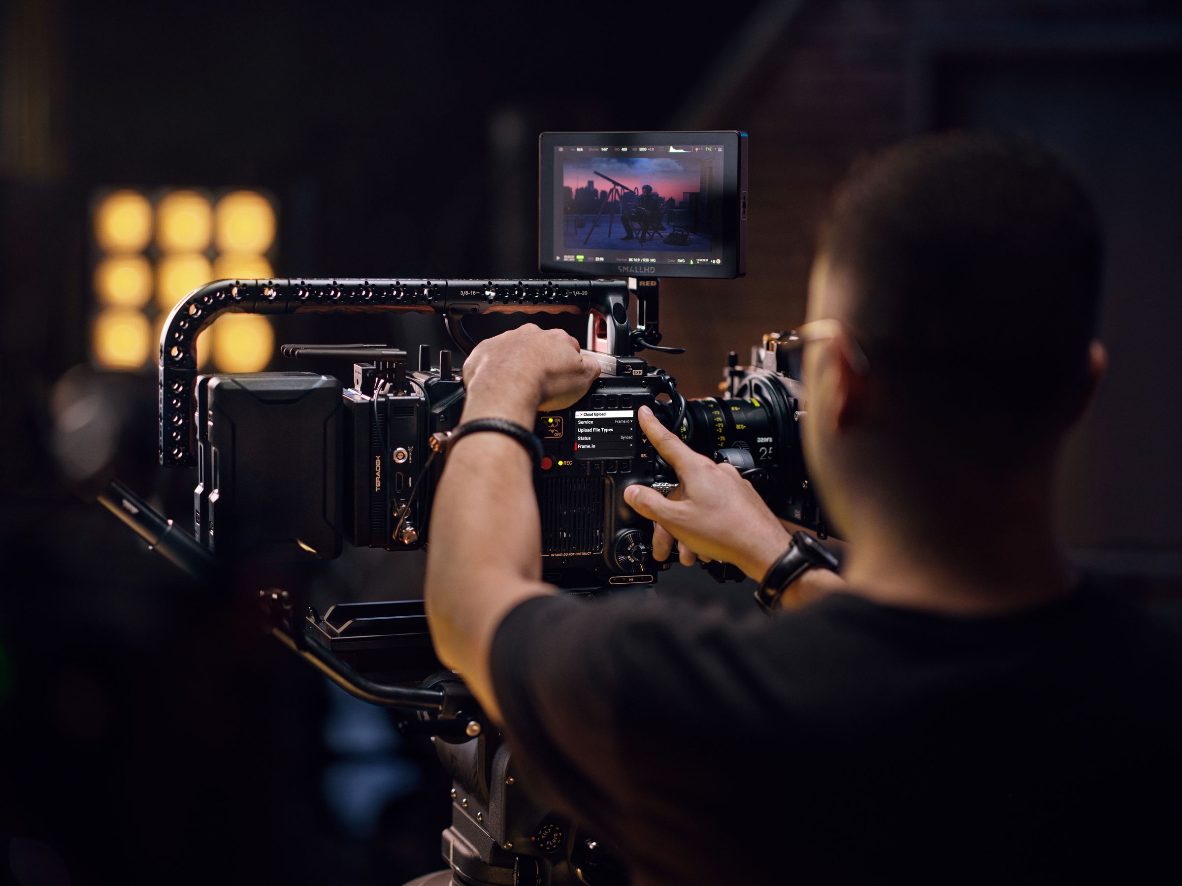 Man selecting Frame.io on RED camera