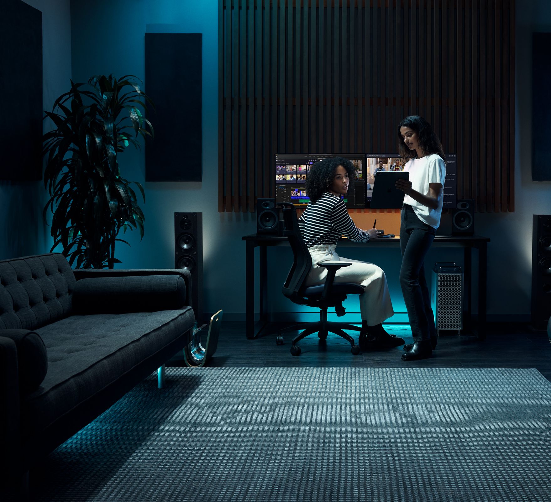 Two women using Frame.io on a computer.