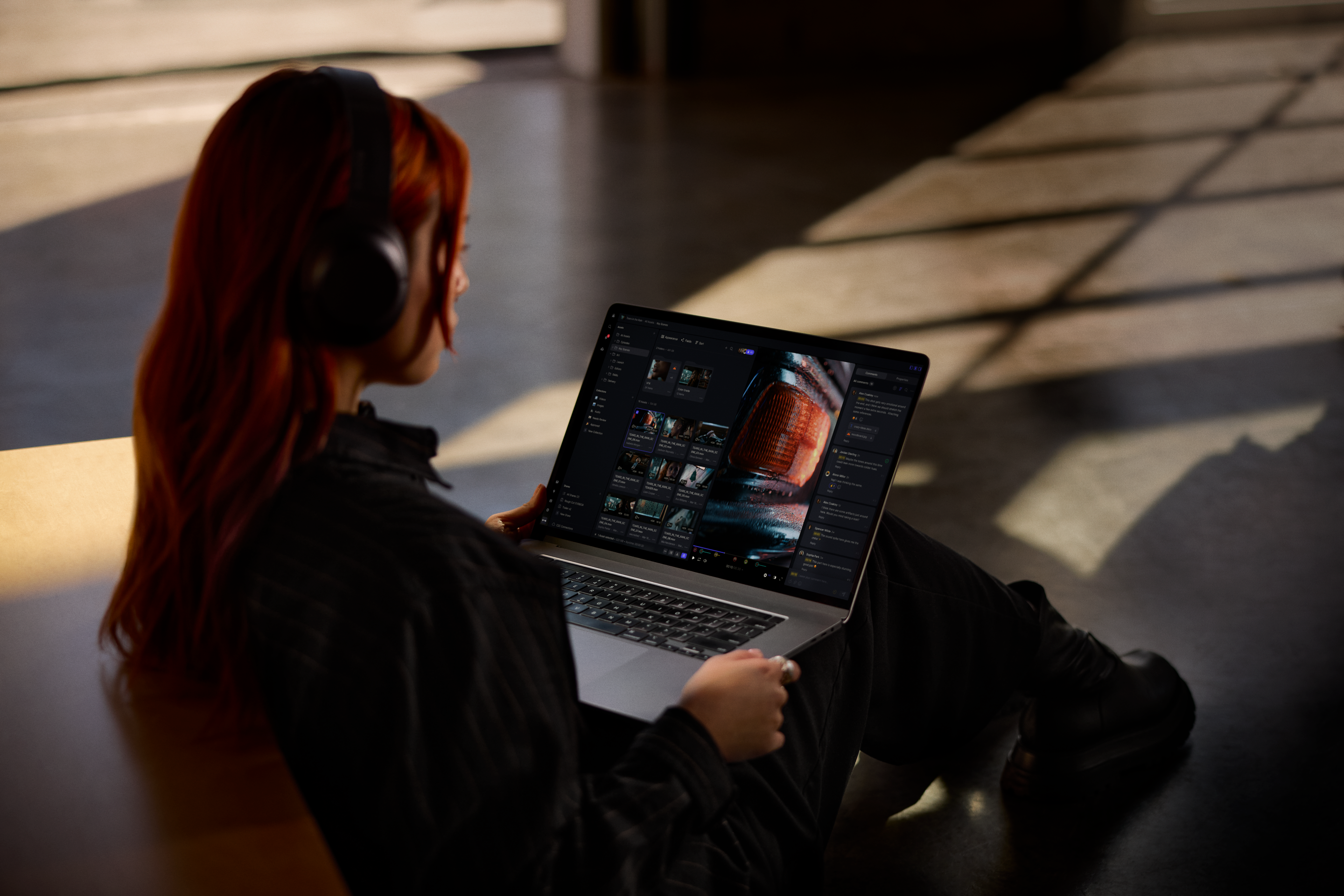Woman holding laptop using Frame.io