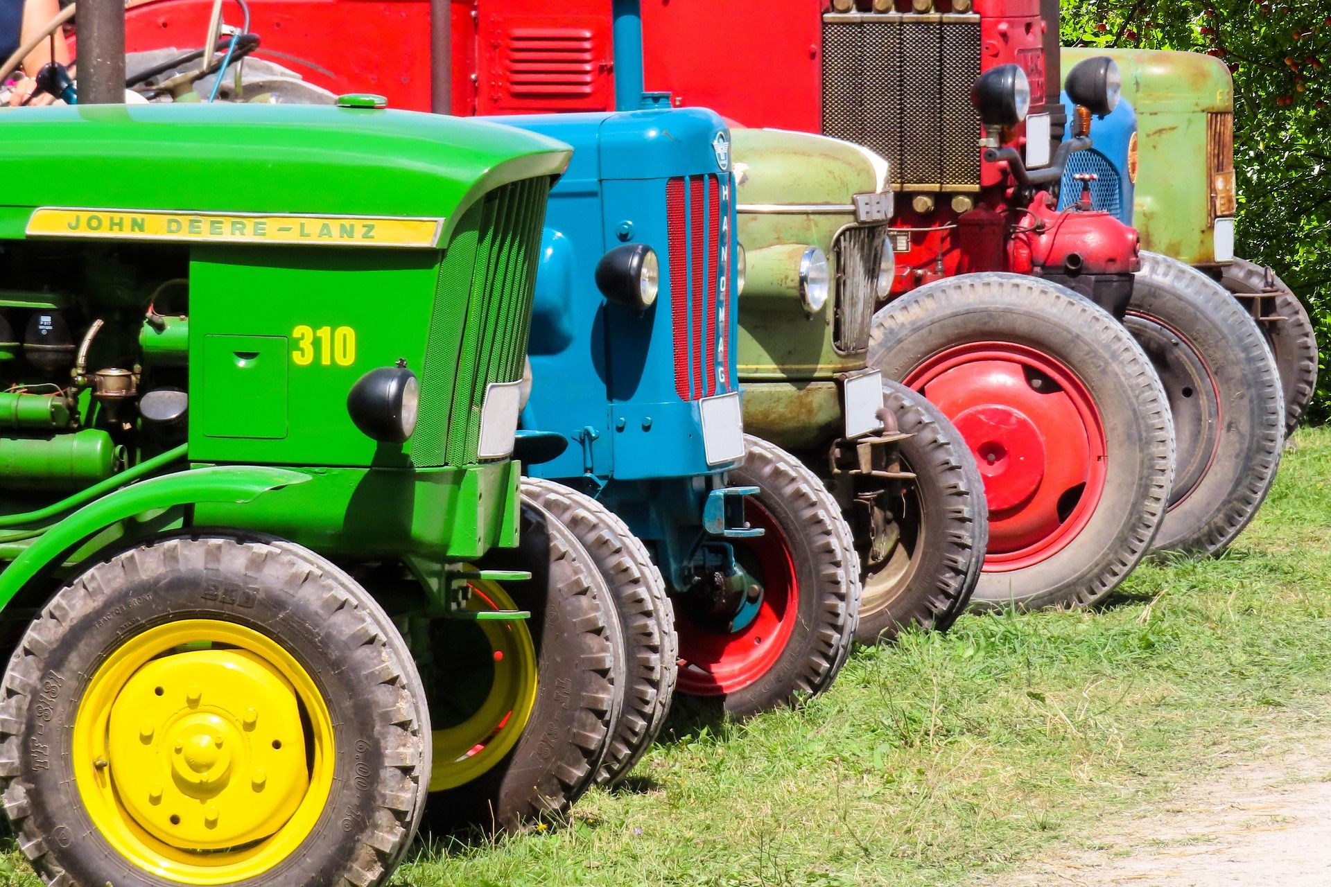 Brand logos on equipment outside Louisiana Tractors dealership