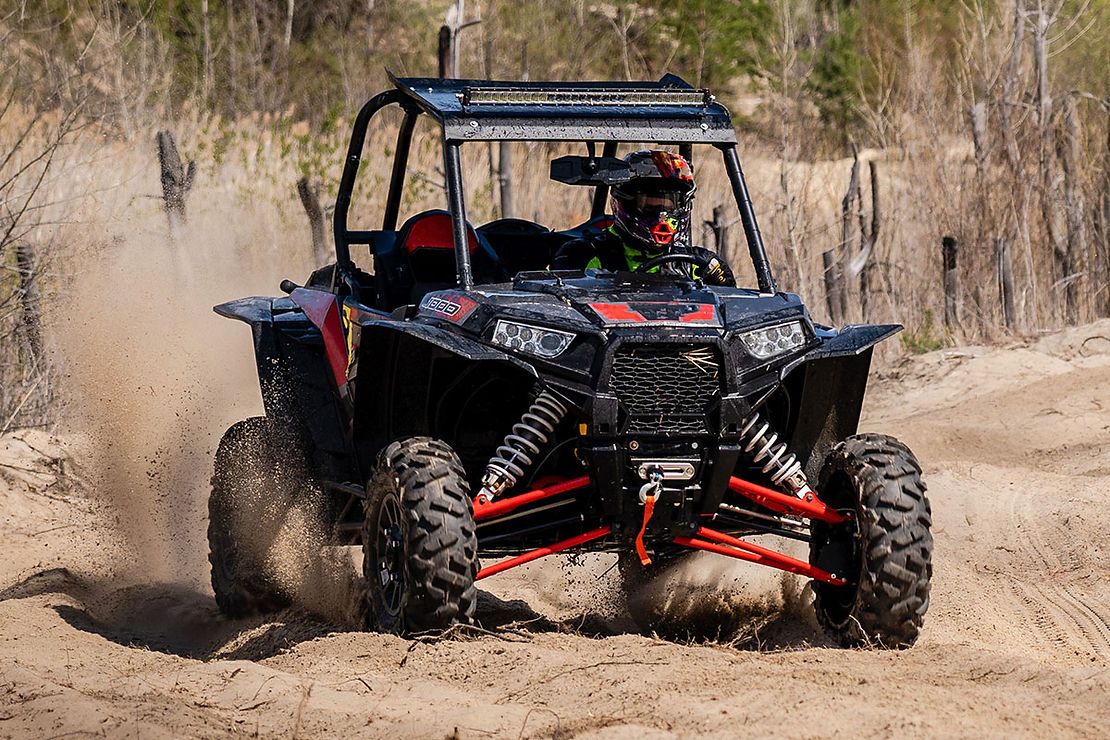 Yanmar and Bad Boy UTVs parked on gravel lot in Louisiana