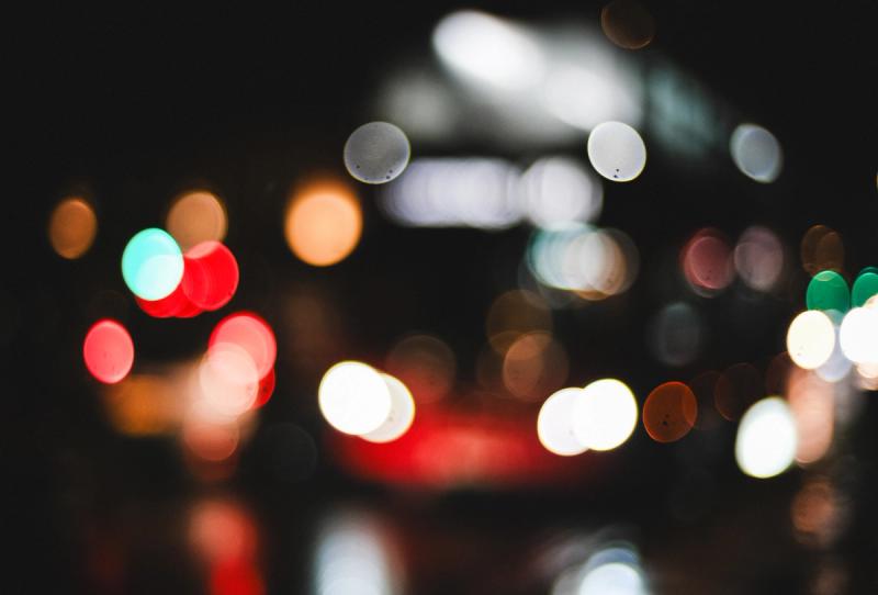 The soft bokeh coloured lights of a 141 London bus at night