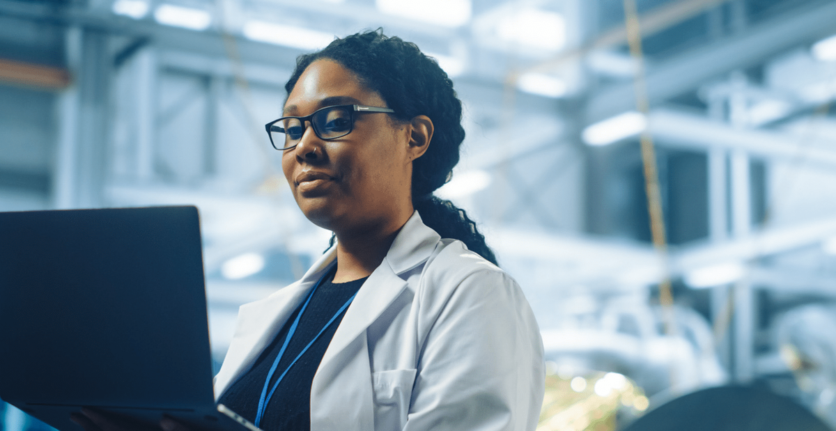 pharma employee holding a laptop