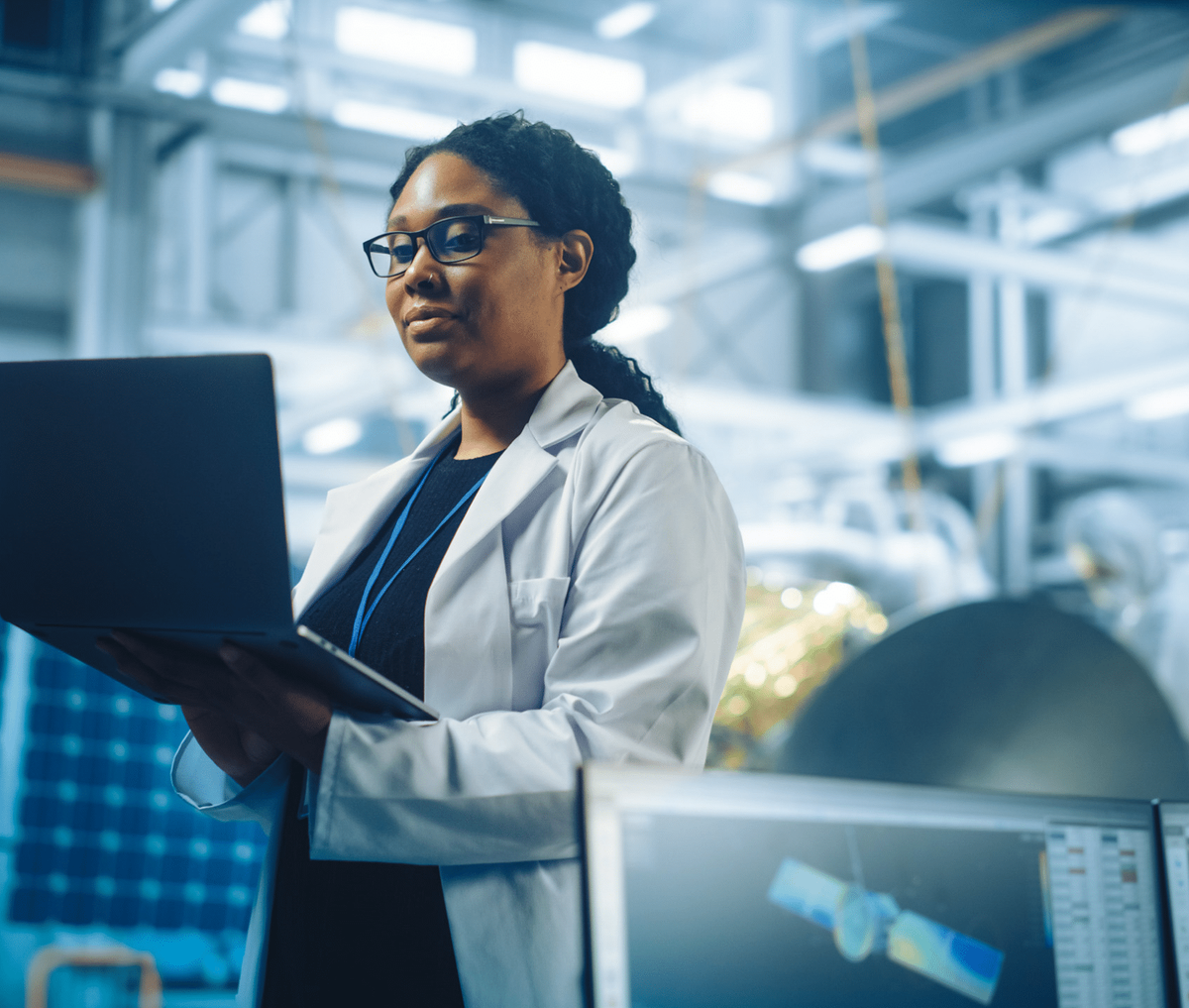 pharma employee holding a laptop