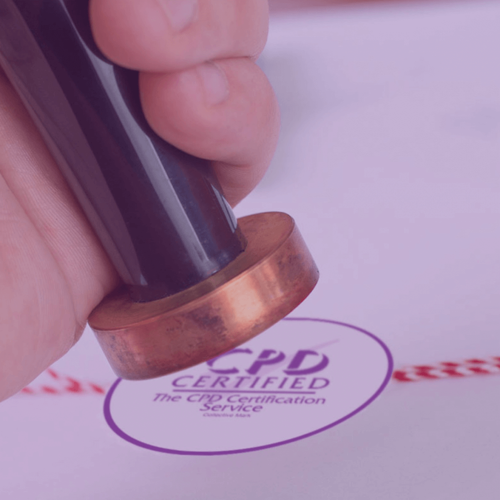Hand pressing a stamp next to the CPD Certified mark from The CPD Certification Service