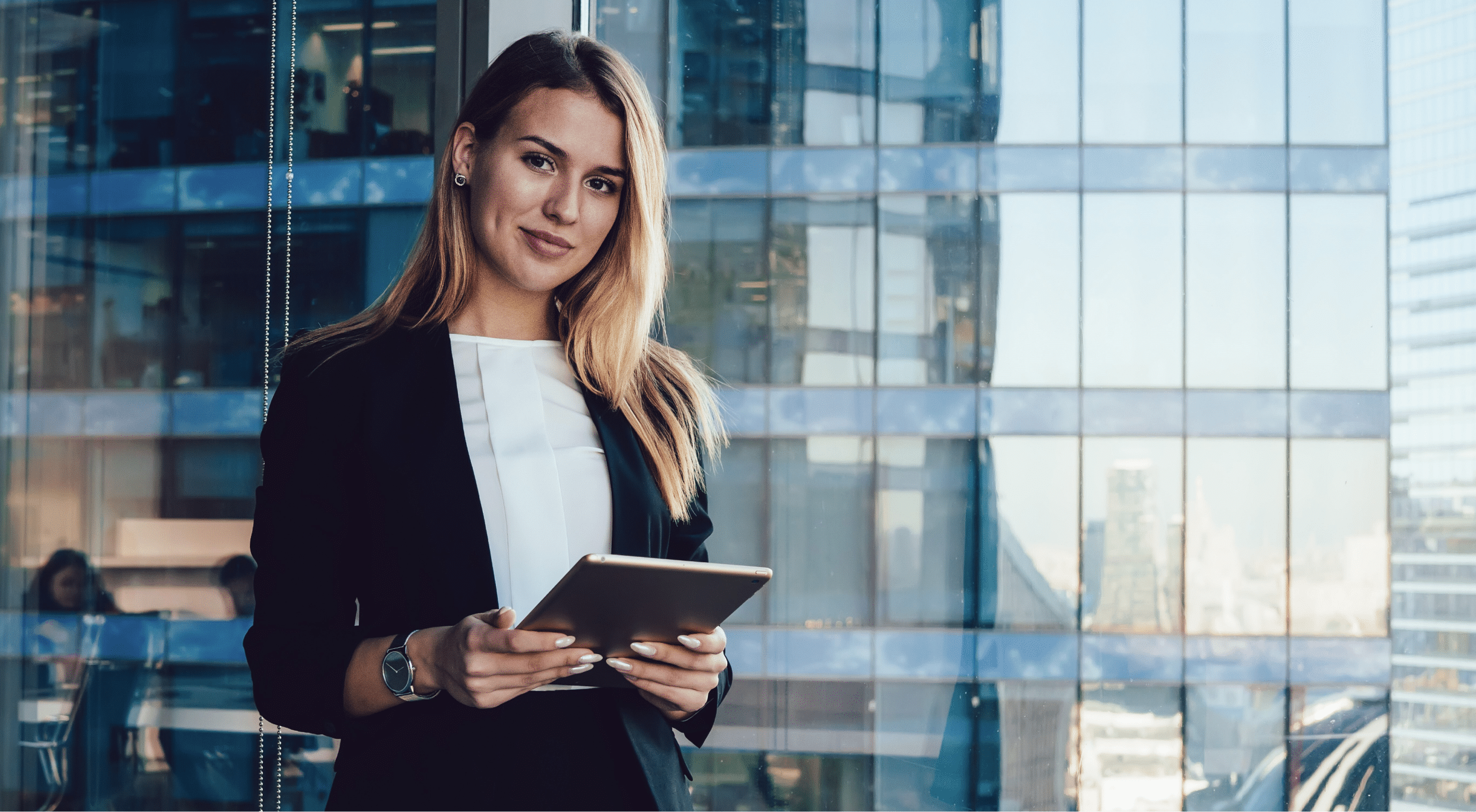 Financial services employee smiling while using a tablet