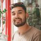 CJ Bashiri, article author, smiling outside a shopfront
