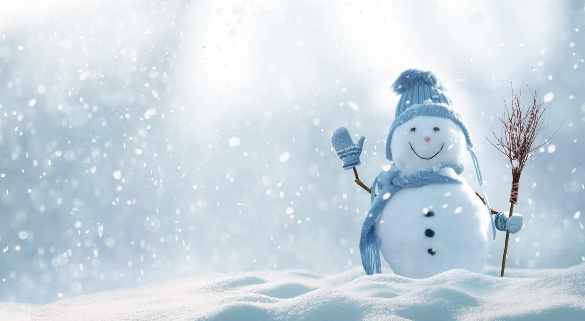 Merry christmas and happy new year greeting card with copy-space. Happy snowman standing in christmas landscape. Snow background.Winter fairytale.