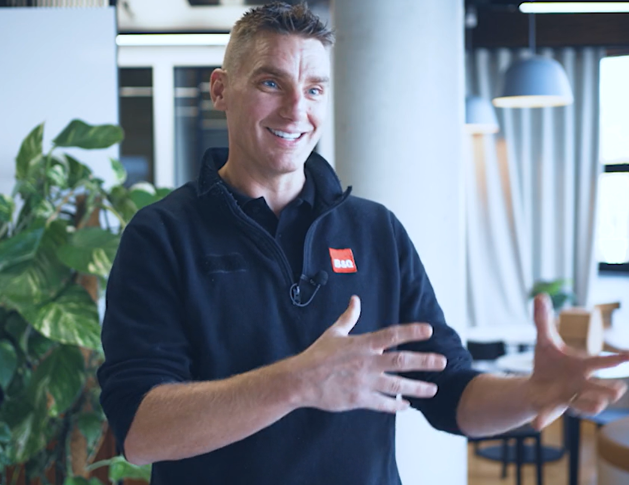 Stuart Mold, gesturing as he talks, in a dark fleece with a B&Q badge