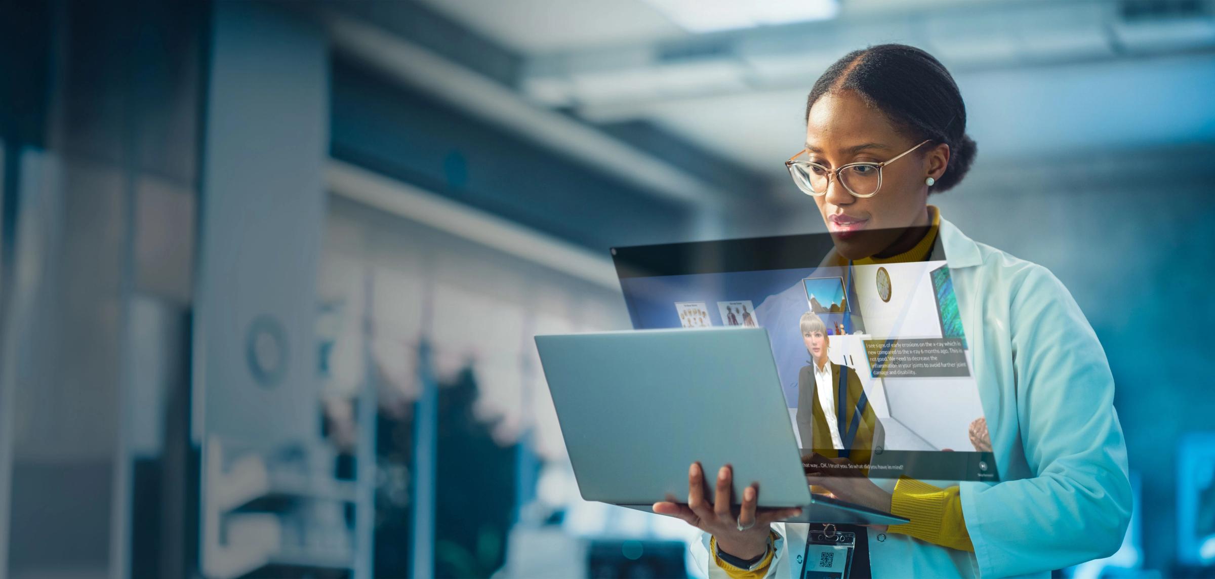 Pharma employee looking on her laptop
