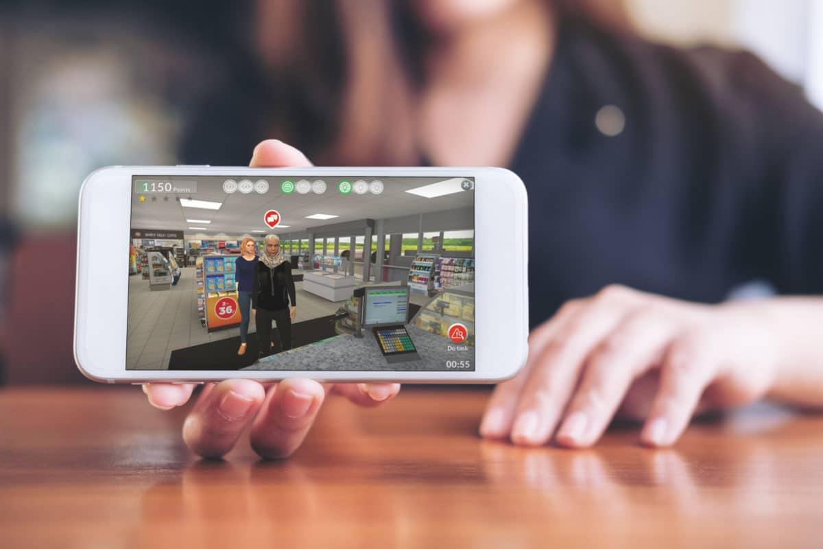 Gamified training on a mobile phone being shown to the viewer 