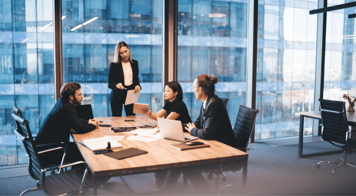 Financial services group of employees discussing in the office