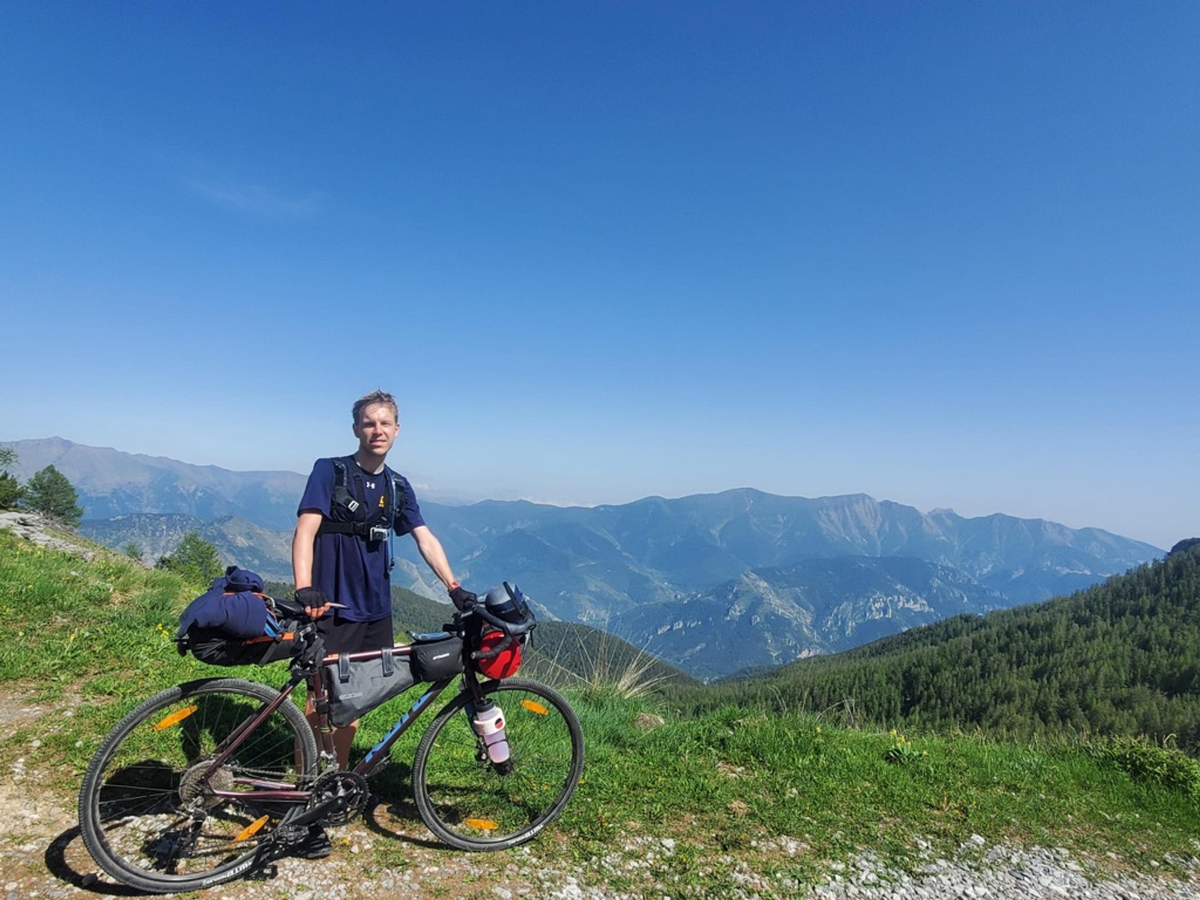 Me posing with my bike at the top of the Tende Mountain Pass.