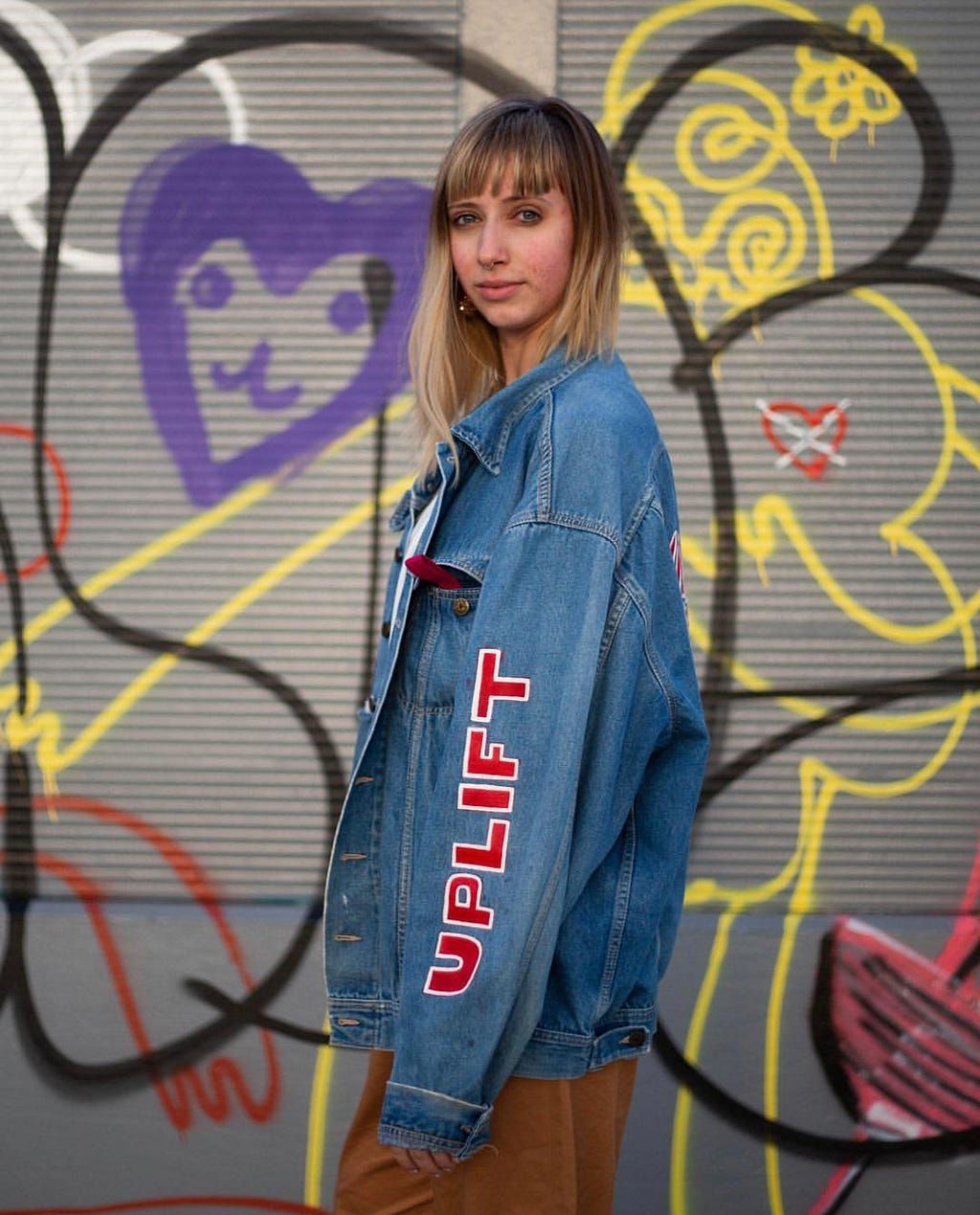 Meghann photographed by Micah E. Wood wearing a jacket designed by her student.