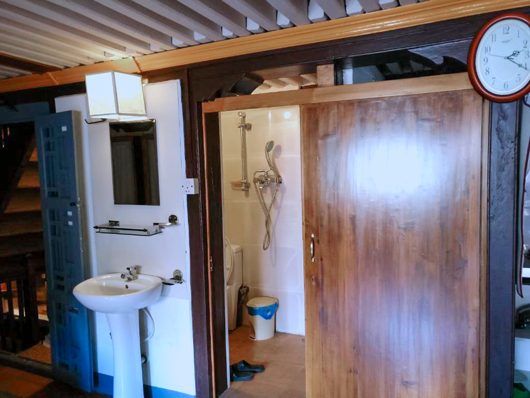 Bathroom shared by Kumari and Barahi with shower and washbasin