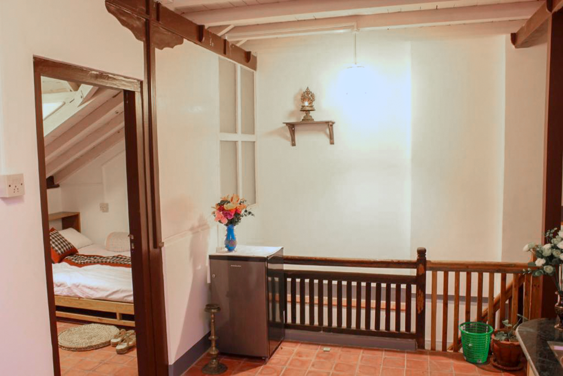 Mahalaxmi upper floor with a timber railing